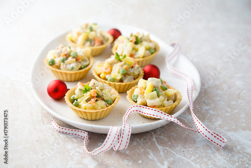 Traditional Russian salad served in tartlets