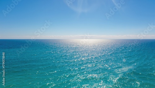 Vast blue ocean meeting the sky, ideal backdrop for editorial design