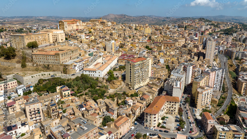 Fototapeta premium Aerial view of the historic center of Agrigento, Sicily, Italy. This Sicilian capital, located on a hilltop, was known in ancient times as Akragas. It's a beautiful, sunny summer day.