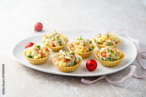 Traditional Russian salad served in tartlets