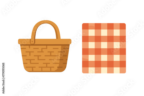Woven wicker picnic basket with orange gingham blanket spread out