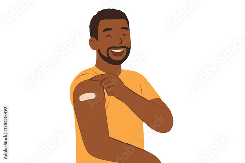 Cheerful Black man pointing to a bandage on his upper arm after receiving a successful immunization shot