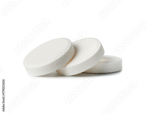 Photos Three medical fizzy pills close-up on a white background