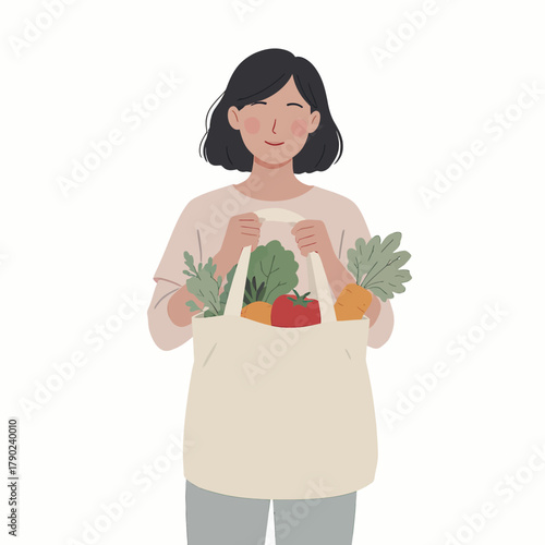 Woman holding a reusable tote bag filled with fresh produce, promoting sustainable shopping and healthy eating habits