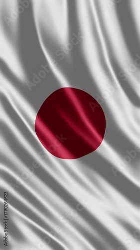 Japanese flag Hinomaru waving in gentle wind.