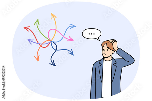 Business man is faced with difficult choice, feeling confused, looking at arrows pointing in different directions. Manager faces difficult choice due to lack of strategy for career growth