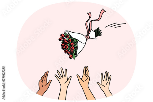 Maids of honor catch bride bouquet during wedding ceremony and traditional game for women attending party. Bride bouquet with flowers is thrown up over hands of bridesmaids who want to find groom