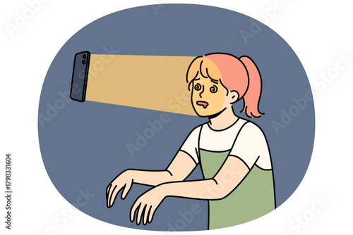 Teenage girl suffers from social media addiction following mobile phone in zombie pose. Problem children digital addiction forcing teenagers to waste time using smartphones and internet applications