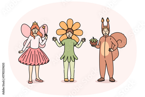 Little children in carnival costumes of squirrel or fairy and flower are ready to go to masquerade party at school. Boy and girls gathered for masquerade dedicated to end of studies in kindergarten