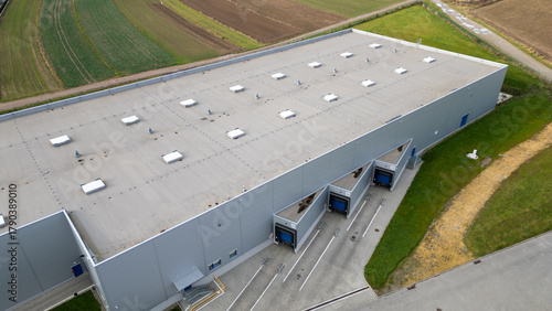 Aerial view of a modern distribution center, showcasing logistics, architecture, and efficiency.