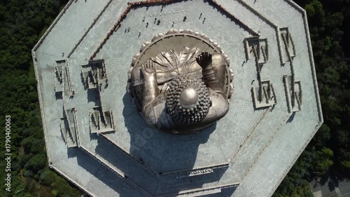 Aerial view of the Golden Buddha statue at Liudingshan Cultural Tourism Area in Dunhua City, Jilin Province, China. Massive golden statue overlooking Zhengjue Temple and facing the Changbai Mountain