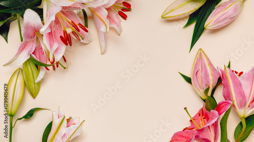 Luxury flower frame with pink lily bouquet and copy space for product presentation, greeting, invitation and design. Pink lily flowers background.