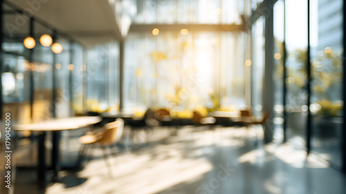 Modern interior with tables chairs and sunlight image