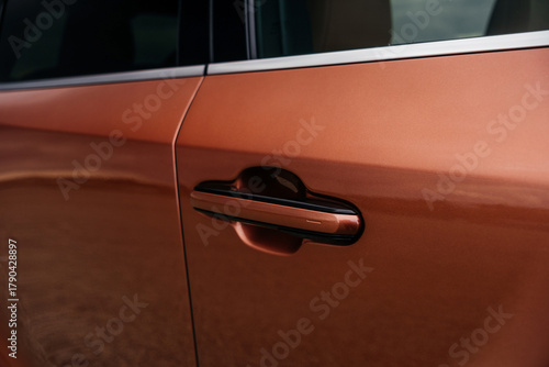 A premium, modern hybrid SUV with an elegant design, incredible color, beautiful wheels, and a large grille.