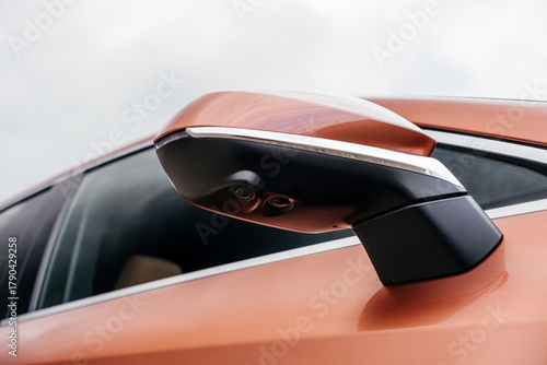 A premium, modern hybrid SUV with an elegant design, incredible color, beautiful wheels, and a large grille.