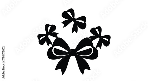 A collection of five black bow tie shapes on a white background view
