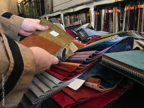 In the company that sells upholstery fabric, it is the woman who chooses the fabric.