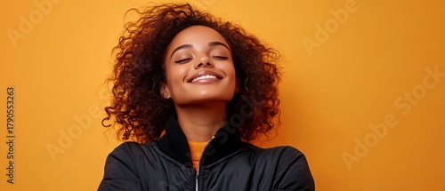 Joyful young lady with crossed arms