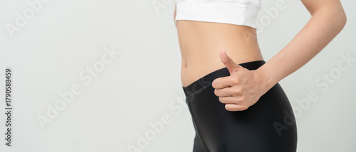 Women showing results of diet. Beautiful shape. female show shape body have a reduced waist size after under going a weight loss corse. balance, control, routines, exercise. © Shisu_ka