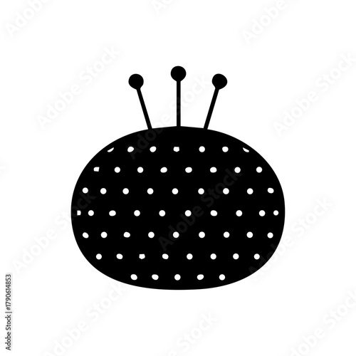 Round pincushion with sewing pins representing tailoring, fashion design, and creative craftsmanship.