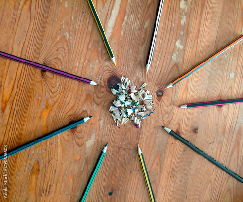 colored pencils on wooden background
Colored pencils neatly arranged on a wooden table.
