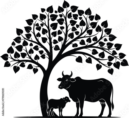 Silhouette of a mother cow and calf standing under a large leafy tree in black and white