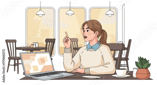 Young woman talking while sitting at a table with laptop in cafe  