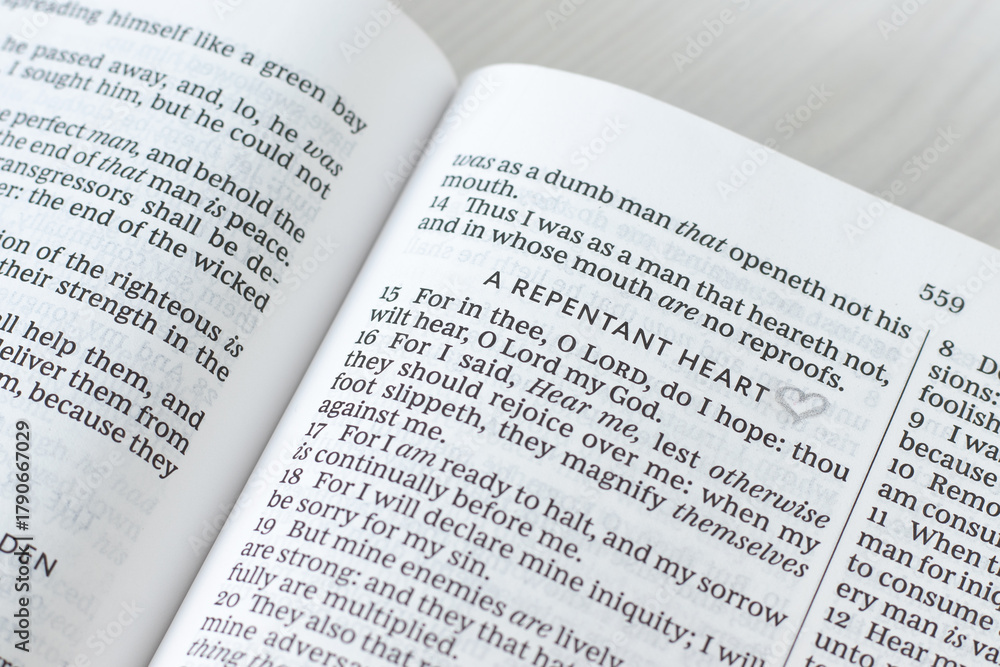 Obraz premium Repentant heart christian text in open holy bible book. Forgiveness, hope, and faith in God Jesus Christ, biblical concept.