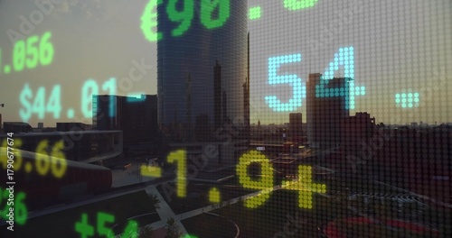 Showing central cylindrical glass tower at downtown plaza through dot-matrix ticker, with $ figures