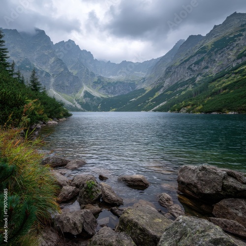 Fototapeta Naklejka Na Ścianę i Meble -  Serene Lake View in Tatra Mountains Poland Cloudy Day Landscape Photography Eye-Level Shot Nature Scene