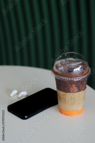 Fototapeta Lifestyle of a relaxing day, drinking coffee and putting down the smartphone wit