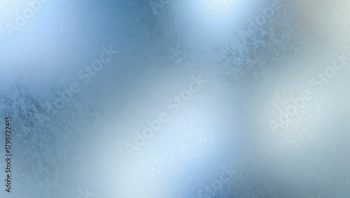 Frosted ice glass surface showing blue and white gradient lighting with shimmering bokeh effect creating an abstract window texture background