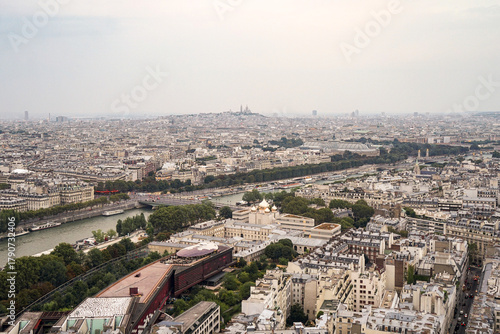 Fototapeta Naklejka Na Ścianę i Meble -  An aerial view of a part of the city of Paris, showing an Orthodox Christian church The church has golden domes, and the streets and the river are visible