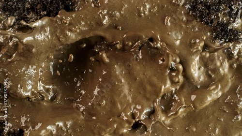 Super Slow Motion Shot of Splashing Mud Background at 1000fps.