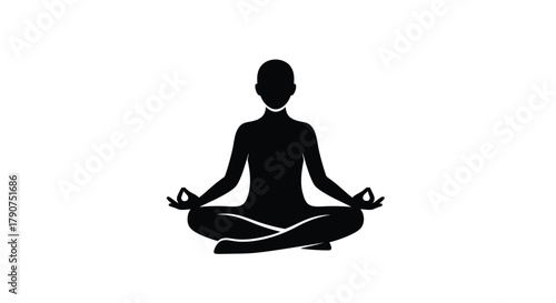 Silhouette of a person meditating in a lotus pose with hands in mudra.