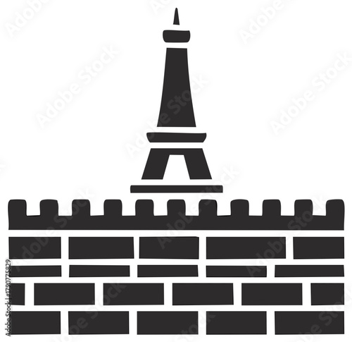 Silhouette of a tower with a wall of bricks