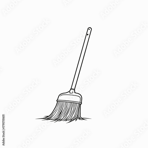Broom standing on white background with bristles touching floor  