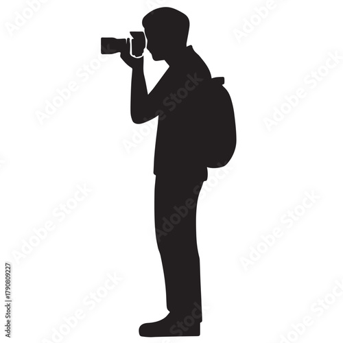 Black silhouette of a standing person with a backpack, holding a camera to their face—capturing a moment, symbolizing travel, exploration, and the art of photography.