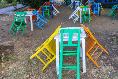 Fototapeta Naklejka Na Ścianę i Meble -  Colourful wooden chairs at Erdek Beach in the Bandirma district.