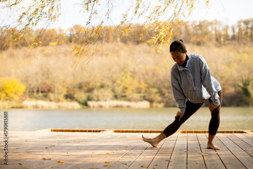 Korean woman stretching by ...