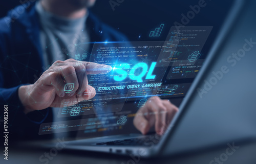A developer using a laptop and digital SQL interface with code, tables, and data icons representing Structured Query Language. Ideal for database, programming, and IT technology concepts.