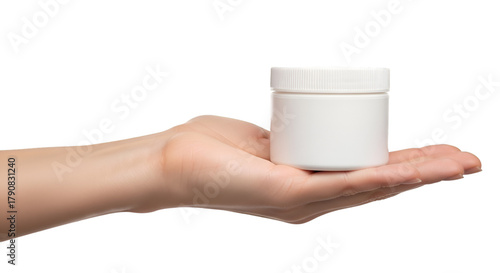 Hand holding a white plastic jar container