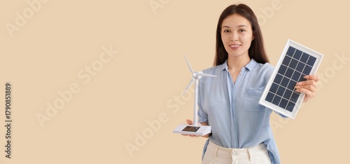 Young Asian woman with wind...