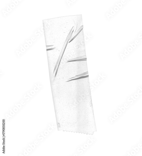 Close up of a piece of transparent tape with lines on a white surface