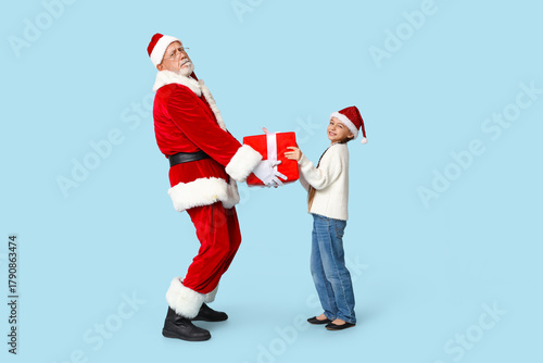 Santa Claus and cute little...