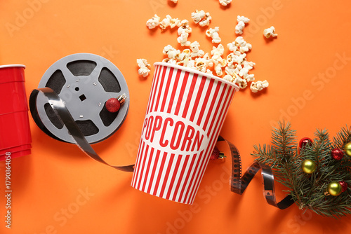 Bucket of popcorn with drin...