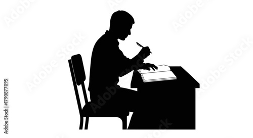 Silhouette of a man seated at a desk writing with a pen
