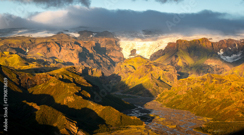 Beautiful sunset in the lush valley of Þórsmörk (Thorsmork) in Iceland’s southern highlands — a dramatic landscape of moss-covered mountains, glacial rivers