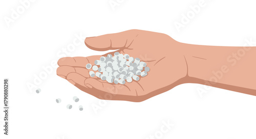 Human hand holding round white capsules on a white background