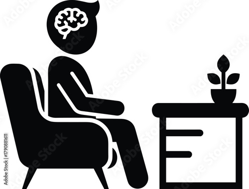 Person sitting in armchair with brain symbol and plant on table mind